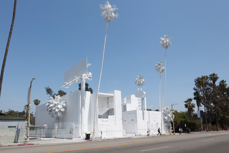 Illustration for article titled Why an Artist Totally Whitewashed This LA Motel—Palm Trees and All